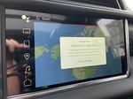 Red[Volcanic Red Tintcoat] 2023 GMC Yukon Denali Navigation Screen Closeup Photo in Calgary AB