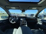 Black[Onyx Black] 2024 GMC Sierra 1500 Strng Wheel/Dash Photo: Frm Rear in Calgary AB