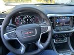 Black[Ebony Twilight Metallic] 2023 GMC Acadia Steering Wheel and Dash Photo in Canmore AB