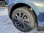 Blue[Lakeshore Blue Metallic] 2024 Chevrolet Equinox Left Front Rim and Tire Photo in Edmonton AB