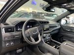Gray[Titanium Rush Metallic] 2023 GMC Yukon Steering Wheel and Dash Photo in Edmonton AB