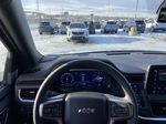 White[Summit White] 2024 Chevrolet Suburban Z71 Steering Wheel and Dash Photo in Calgary AB
