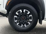 White[Glacier White] 2022 Nissan Frontier Left Front Rim and Tire Photo in Kelowna BC