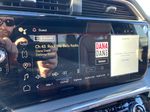 Black[Onyx Black] 2024 GMC Sierra 3500HD Denali Ultimate Radio Controls Closeup Photo in Calgary AB