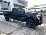 Black[Onyx Black] 2024 GMC Sierra 3500HD AT4 Right Front Corner Photo in Calgary AB