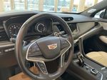 Blue[Dark Moon Blue Metallic] 2021 Cadillac XT5 Steering Wheel and Dash Photo in Edmonton AB