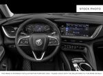 White[White Frost Tricoat] 2023 Buick Envision Steering Wheel and Dash Photo in Medicine Hat AB