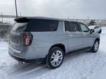 Gray[Sterling Grey Metallic] 2024 Chevrolet Suburban High Country Right Rear Corner Photo in Calgary AB