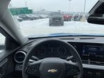 Blue[Marina Blue Metallic] 2025 Chevrolet Trax LS Steering Wheel and Dash Photo in Calgary AB