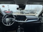 Black[Mosaic Black Metallic] 2025 Chevrolet Trax Strng Wheel/Dash Photo: Frm Rear in Edmonton AB