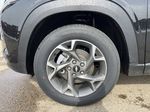 Black[Mosaic Black Metallic] 2025 Chevrolet Trax Left Front Rim and Tire Photo in Edmonton AB