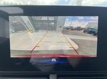 Red[Crimson Metallic] 2025 Chevrolet Trax Backup Camera Closeup Photo in Calgary AB