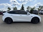 White[Pearl White Multi-Coat] 2023 Tesla Model Y Right Side Photo in Edmonton AB