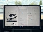 White[Pearl White Multi-Coat] 2023 Tesla Model Y Radio Controls Closeup Photo in Edmonton AB