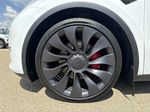 White[Pearl White Multi-Coat] 2023 Tesla Model Y Left Front Rim and Tire Photo in Edmonton AB