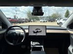 White[Pearl White Multi-Coat] 2023 Tesla Model Y Strng Wheel/Dash Photo: Frm Rear in Edmonton AB