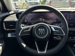 Gray[Moonstone Grey Metallic] 2025 Buick Envision Steering Wheel and Dash Photo in Edmonton AB