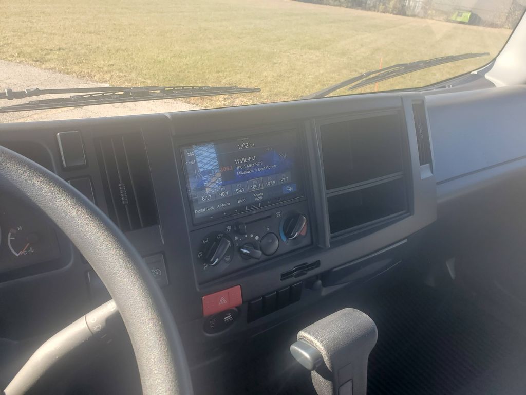 Slide images of 2024 ISUZU NPRGAS