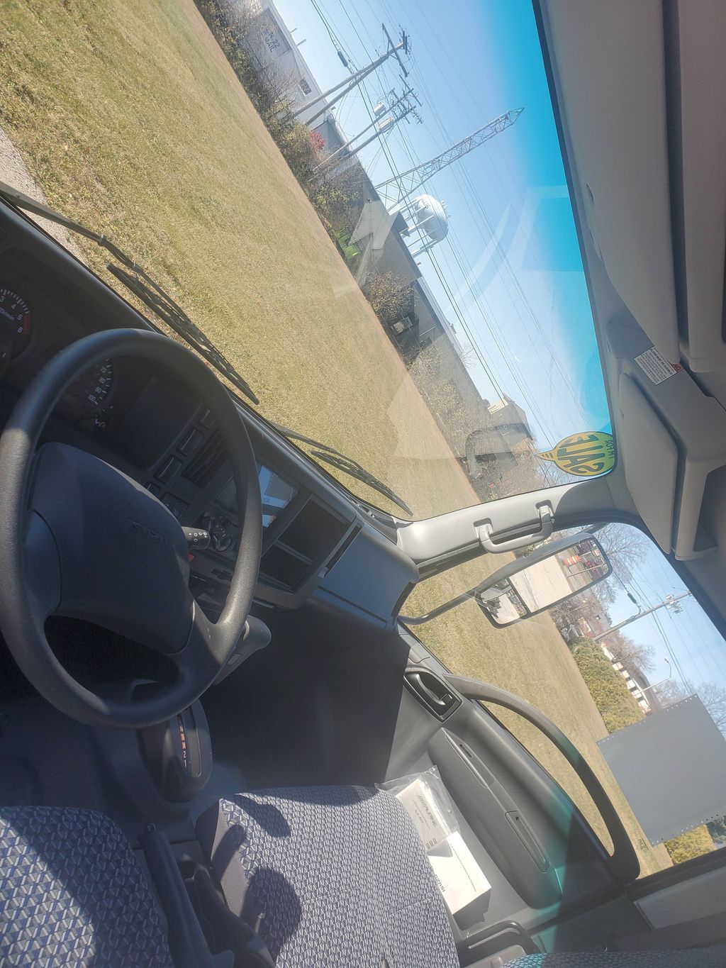 Slide images of 2024 ISUZU NPR GAS-HD