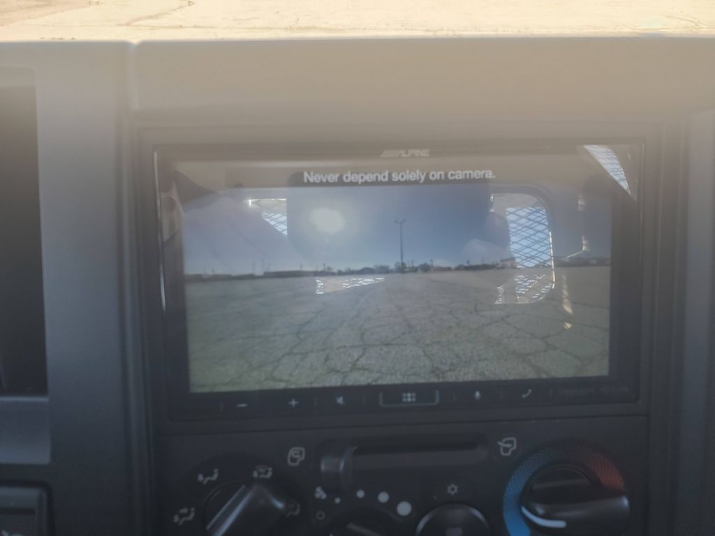 Slide images of 2025 ISUZU NPR GAS-HD