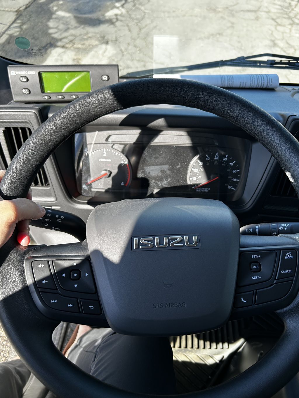 Slide images of 2026 ISUZU NPR-XD
