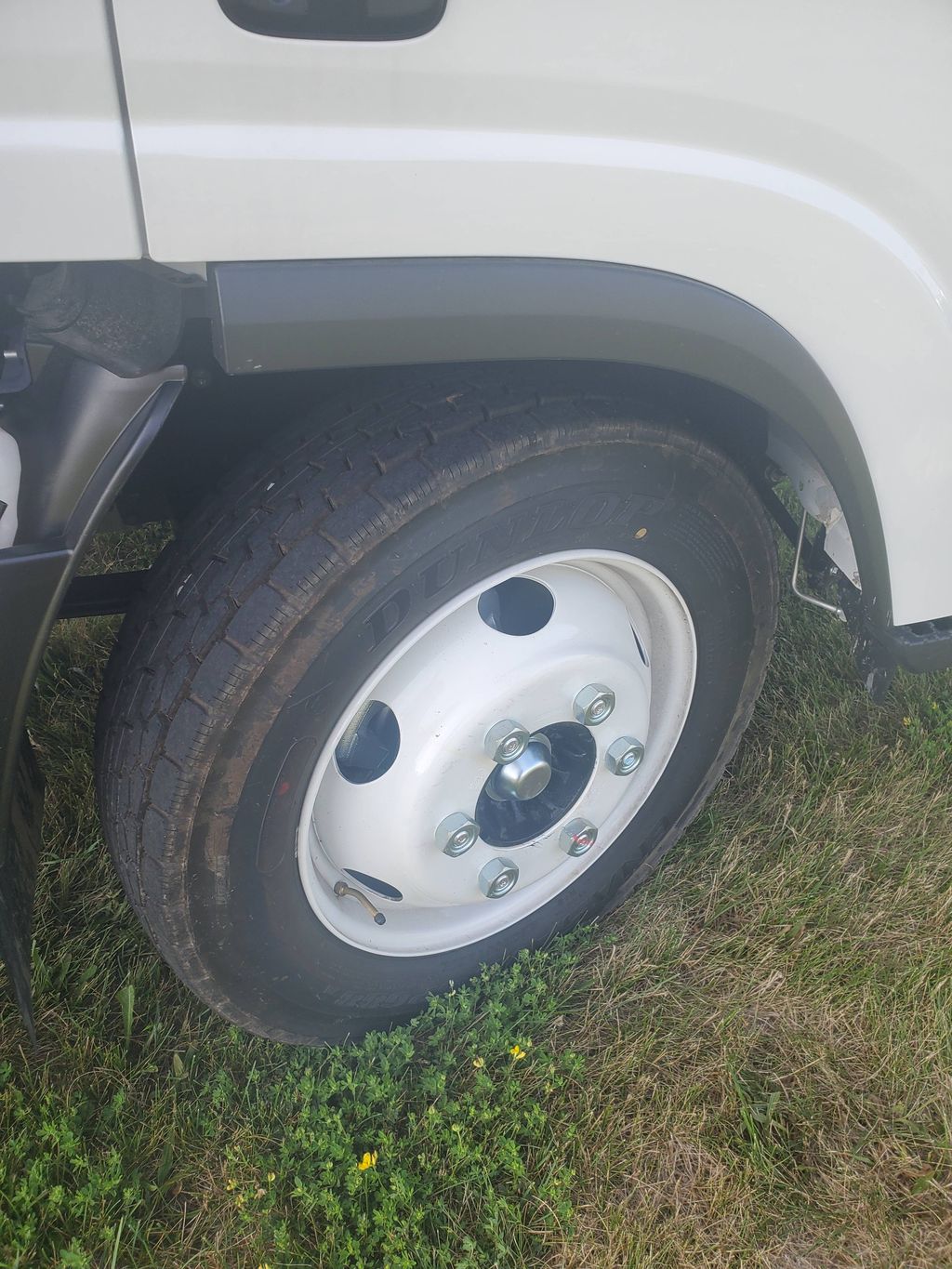 Slide images of 2026 ISUZU NPR GAS HD