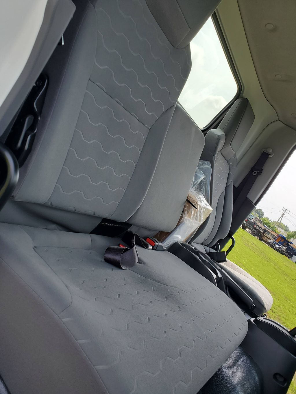 Slide images of 2026 ISUZU NPR XD
